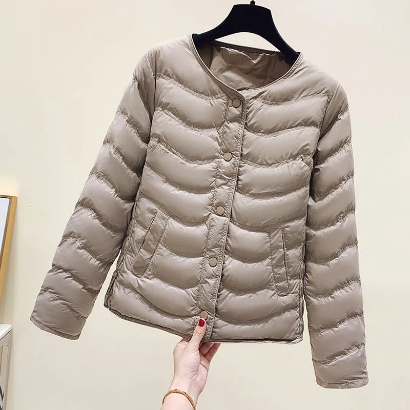 The inner tank keeps warm and light small cotton clothes for women's autumn and winter new 2025 round neck short cotton jacket for small people to wear cotton clothes outside