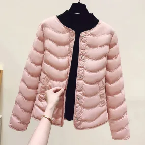 The inner tank keeps warm and light small cotton clothes for women's autumn and winter new 2025 round neck short cotton jacket for small people to wear cotton clothes outside