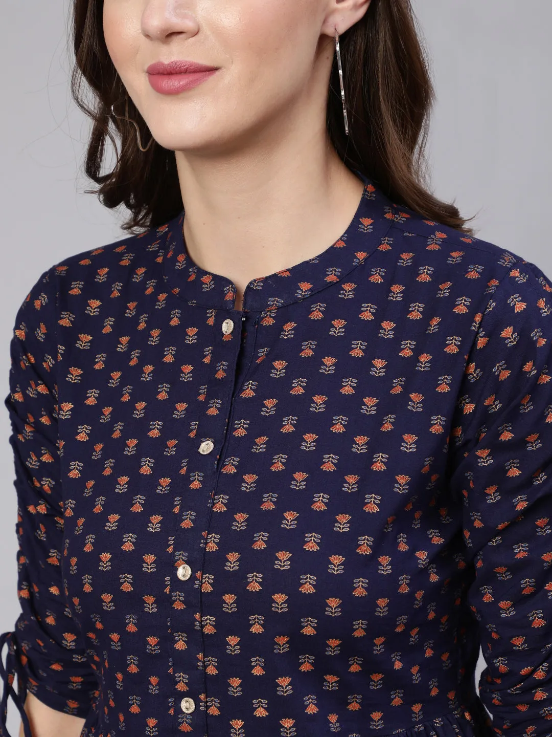 Women Navy Blue & Gold Printed Peplon Top